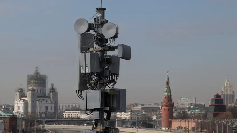 A view of a cellular tower with the Christ The Savior cathedral and the Kremlin's tower in the background in central Moscow