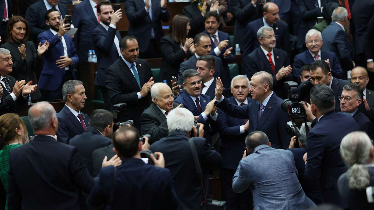 Turkey's President Tayyip Erdogan greets members of parliament in Ankara