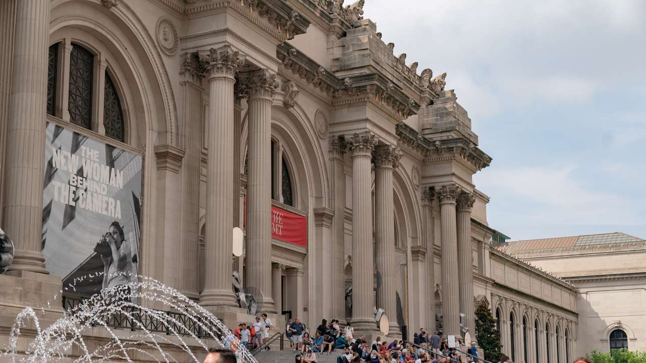 FILE PHOTO: People stand outside The Metropolitan Museum of Art in New York City