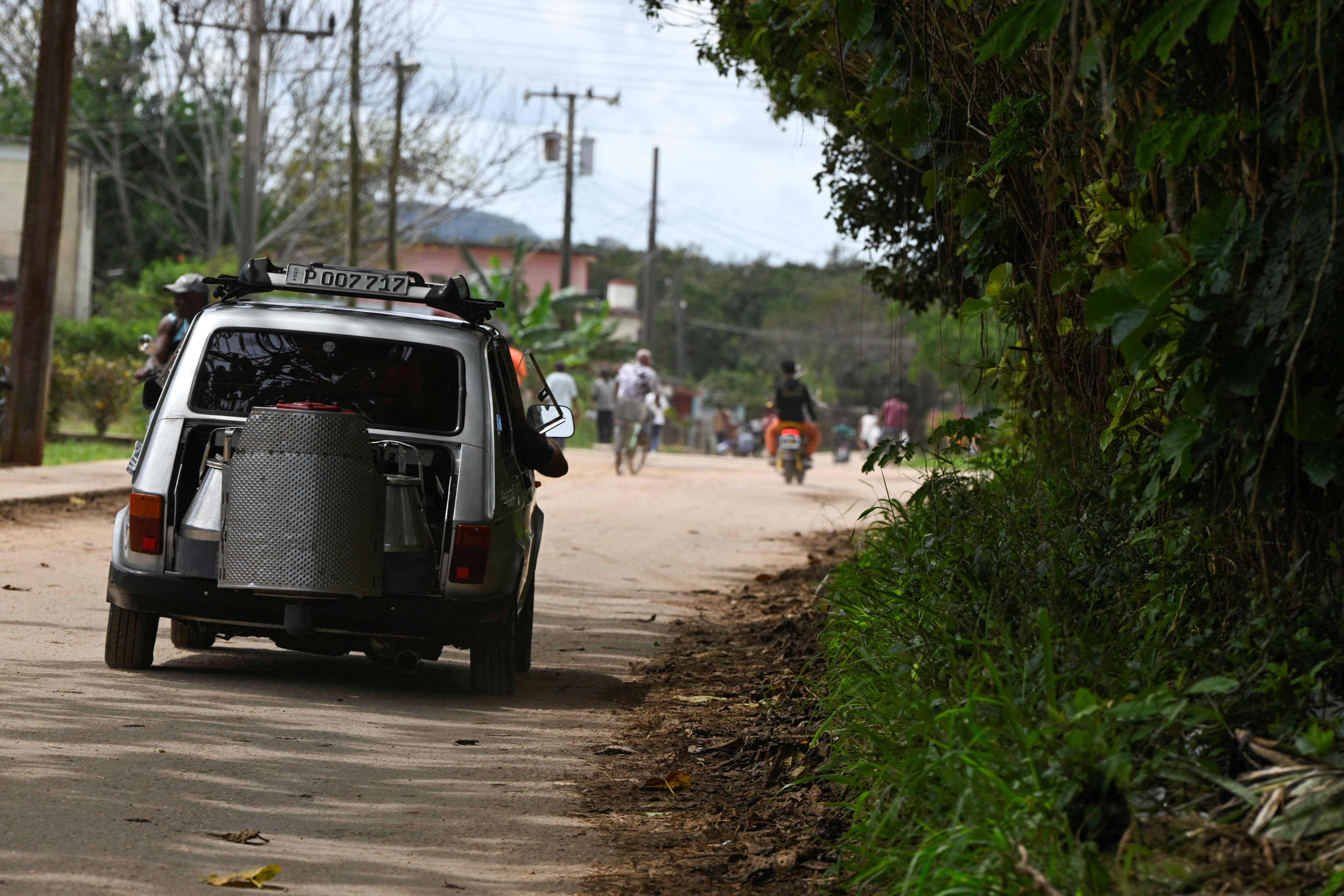 Facing U.S. oil blockade, Cuban man powers car with charcoal