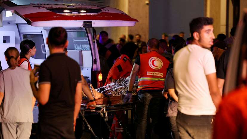 FILE PHOTO: A person is carried outside American University of Beirut Medical Center, including Hezbollah fighters and medics, were wounded and killed when the pagers they use to communicate exploded across Lebanon, according to a security source, in Beiru