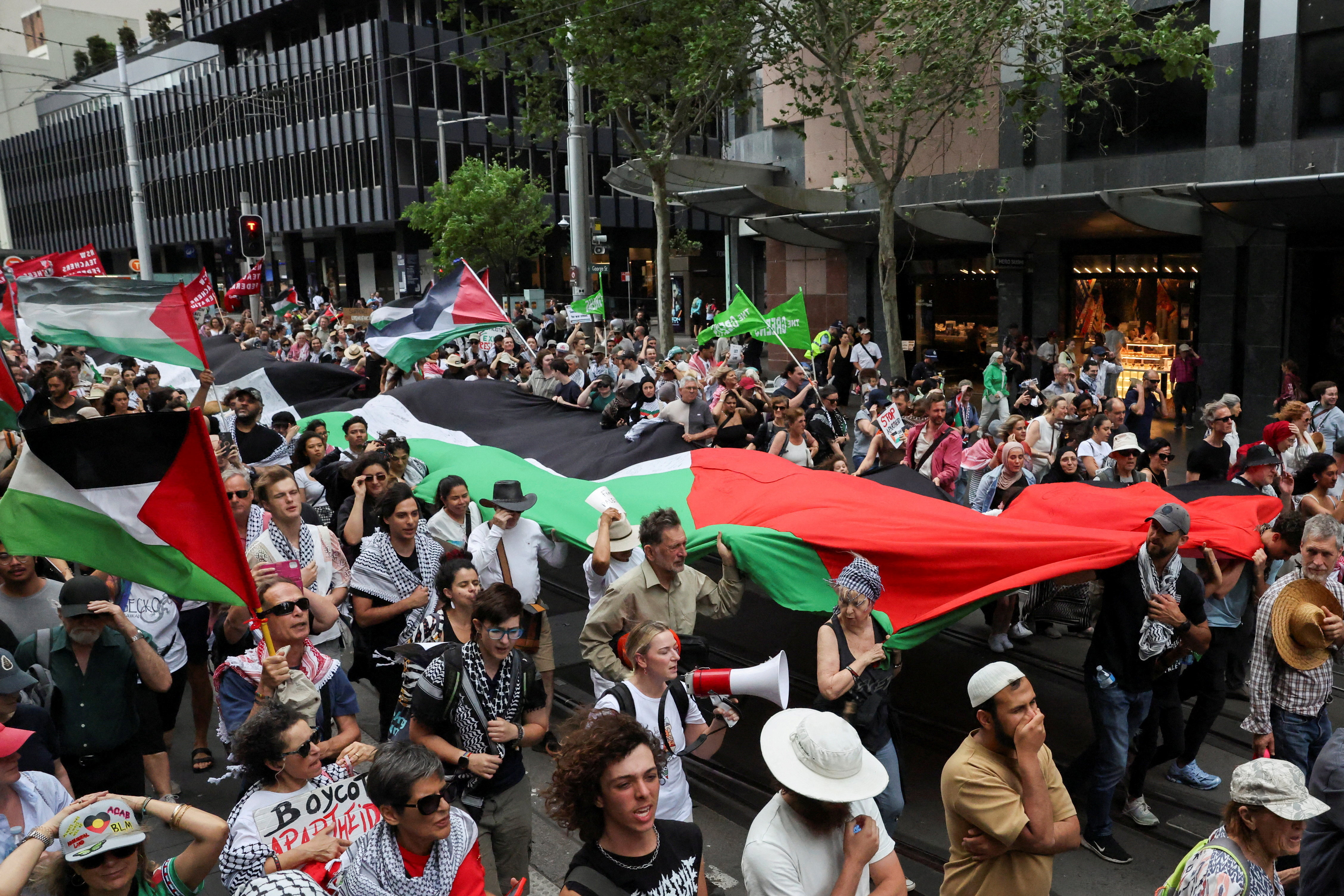 People take part in the 'Nationwide March for Palestine' in Sydney