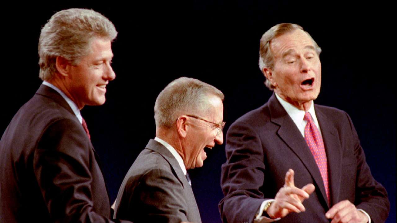 FILE PHOTO: Clinton, Perot and Bush laugh at the conclusion of their 1992 Presidential debate in East Lansing