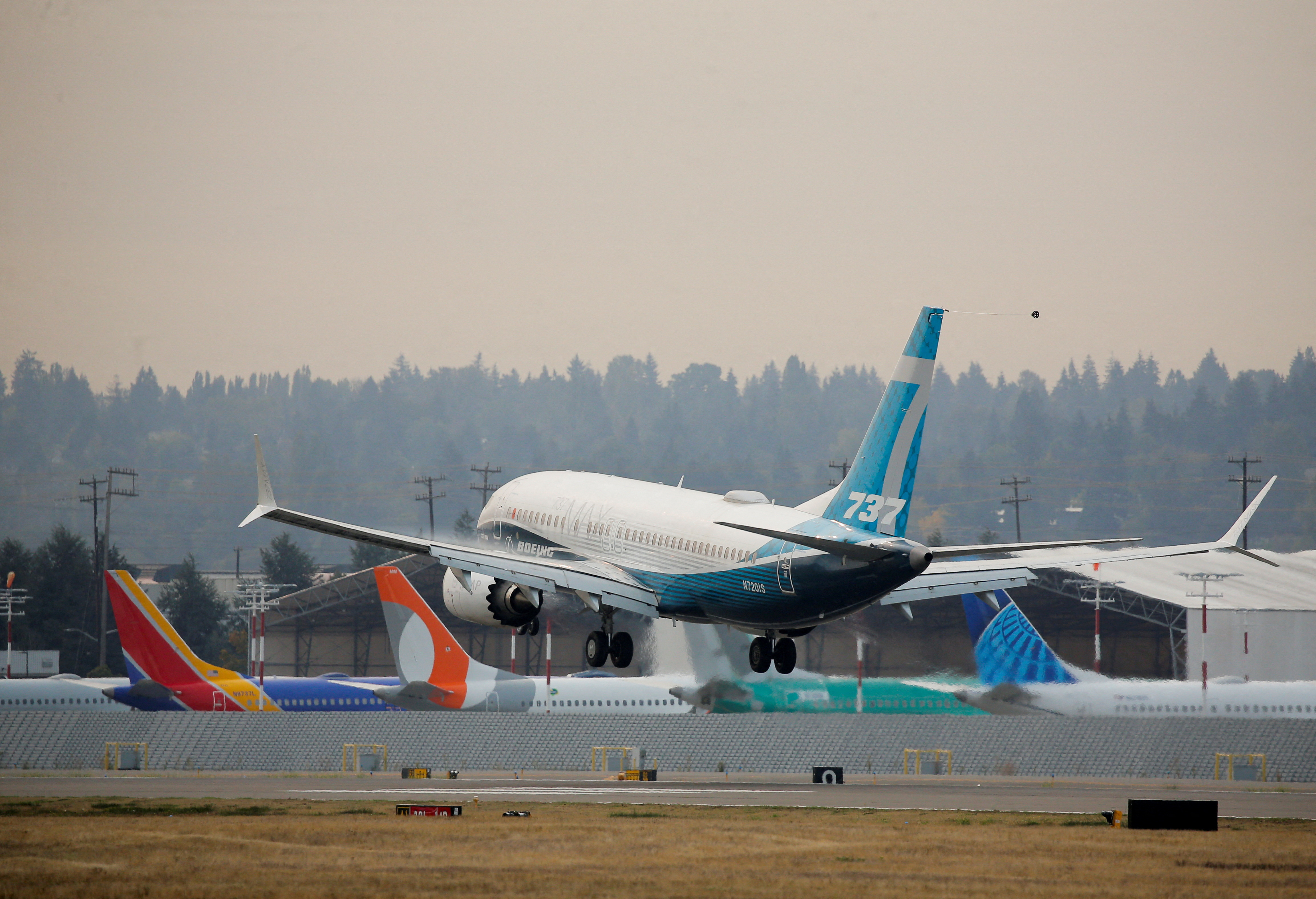 FILE PHOTO: A Boeing 737 MAX aircraft lands during an evaluation flight in Seattle