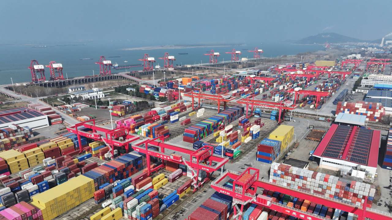 Containers and cargo ships at a port in Wuhu