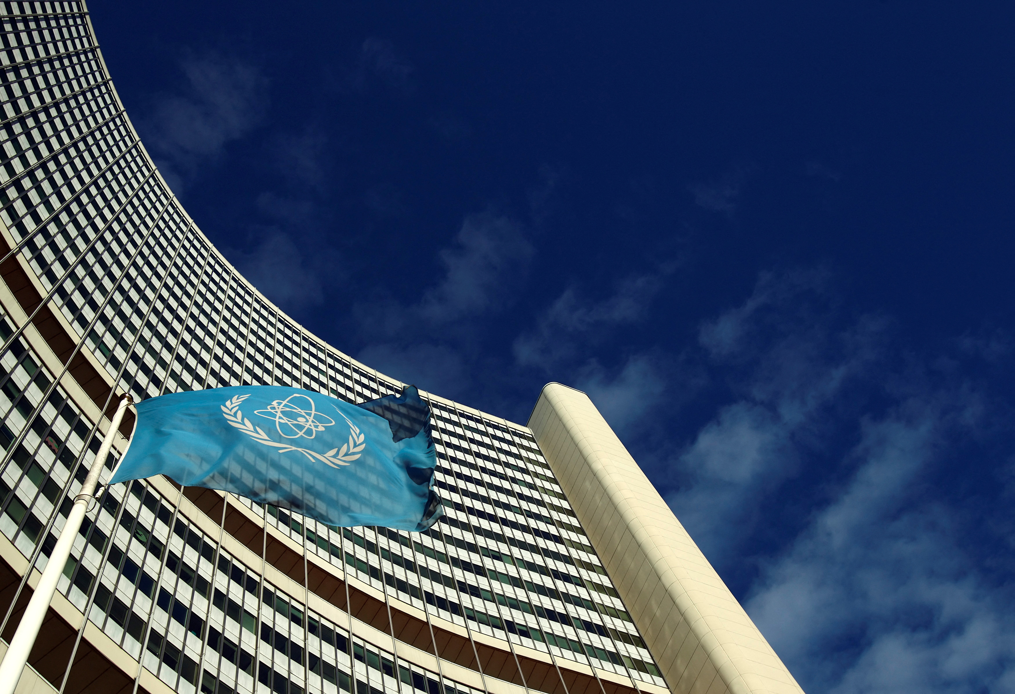 FILE PHOTO: The flag of the International Atomic Energy Agency IAEA flies in front of its headquarters during a board of governors meeting in Vienna