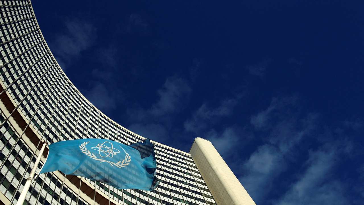 FILE PHOTO: The flag of the International Atomic Energy Agency IAEA flies in front of its headquarters during a board of governors meeting in Vienna