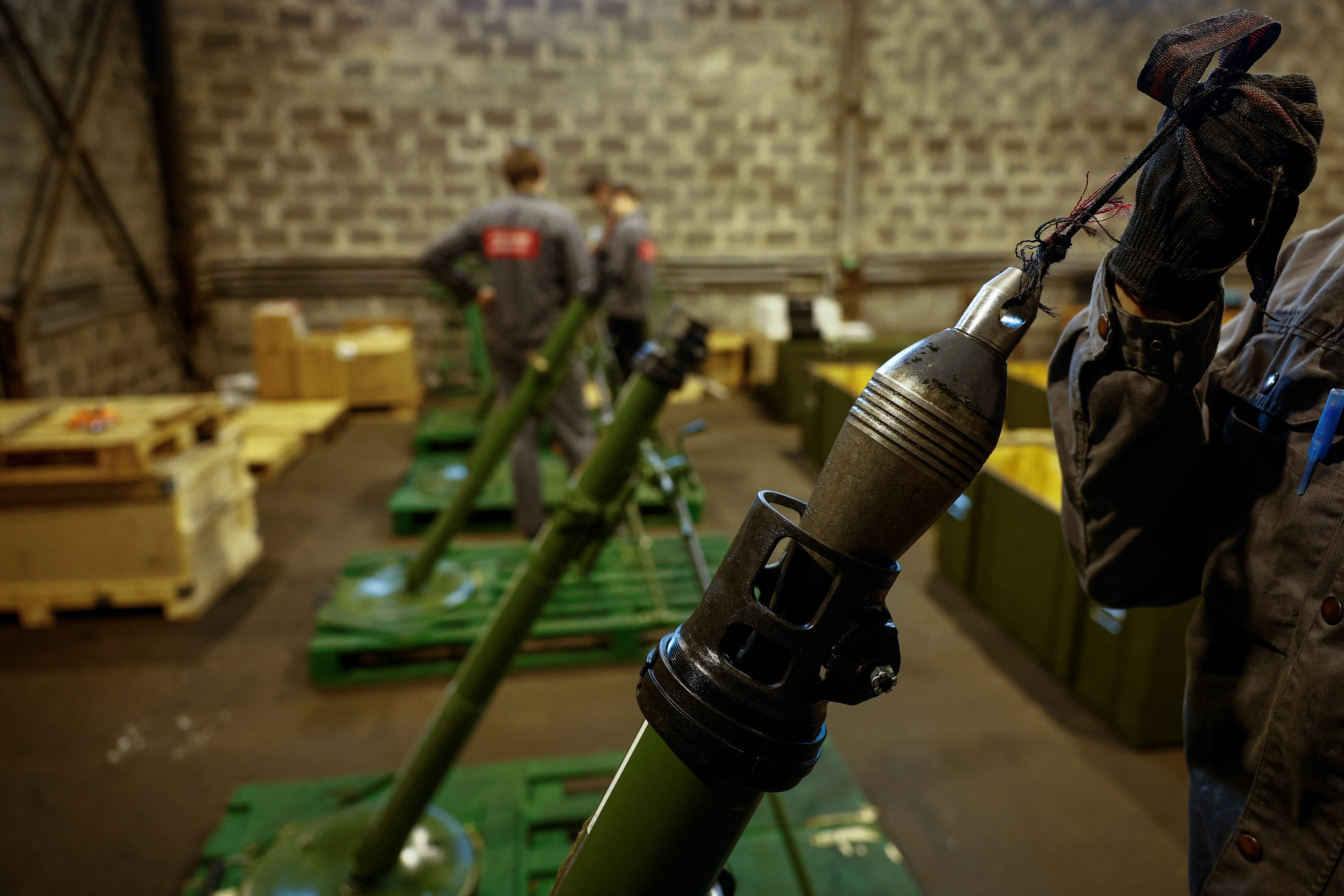 Employee checks a mortar at a production facility of the 'Ukrainian Armor' company in Ukraine