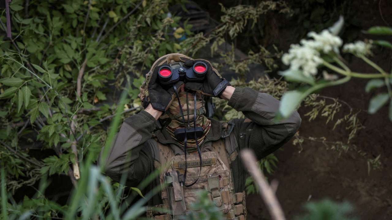 FILE PHOTO: A Ukrainian serviceman from an air defence unit monitors the sky at a frontline near the town of Bakhmut