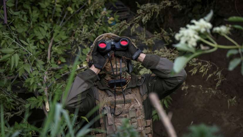 FILE PHOTO: A Ukrainian serviceman from an air defence unit monitors the sky at a frontline near the town of Bakhmut