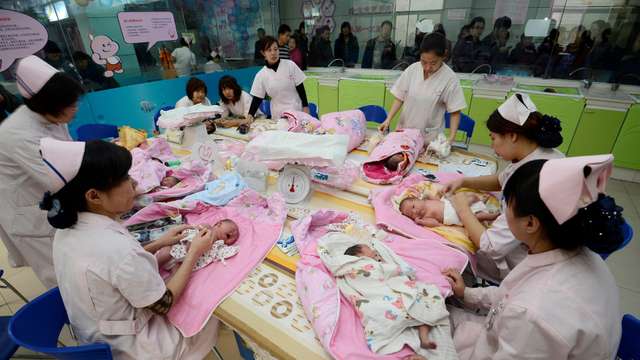 FILE PHOTO: Infants undergo a daily medical examination at a maternal and child health care hospital in Taiyuan