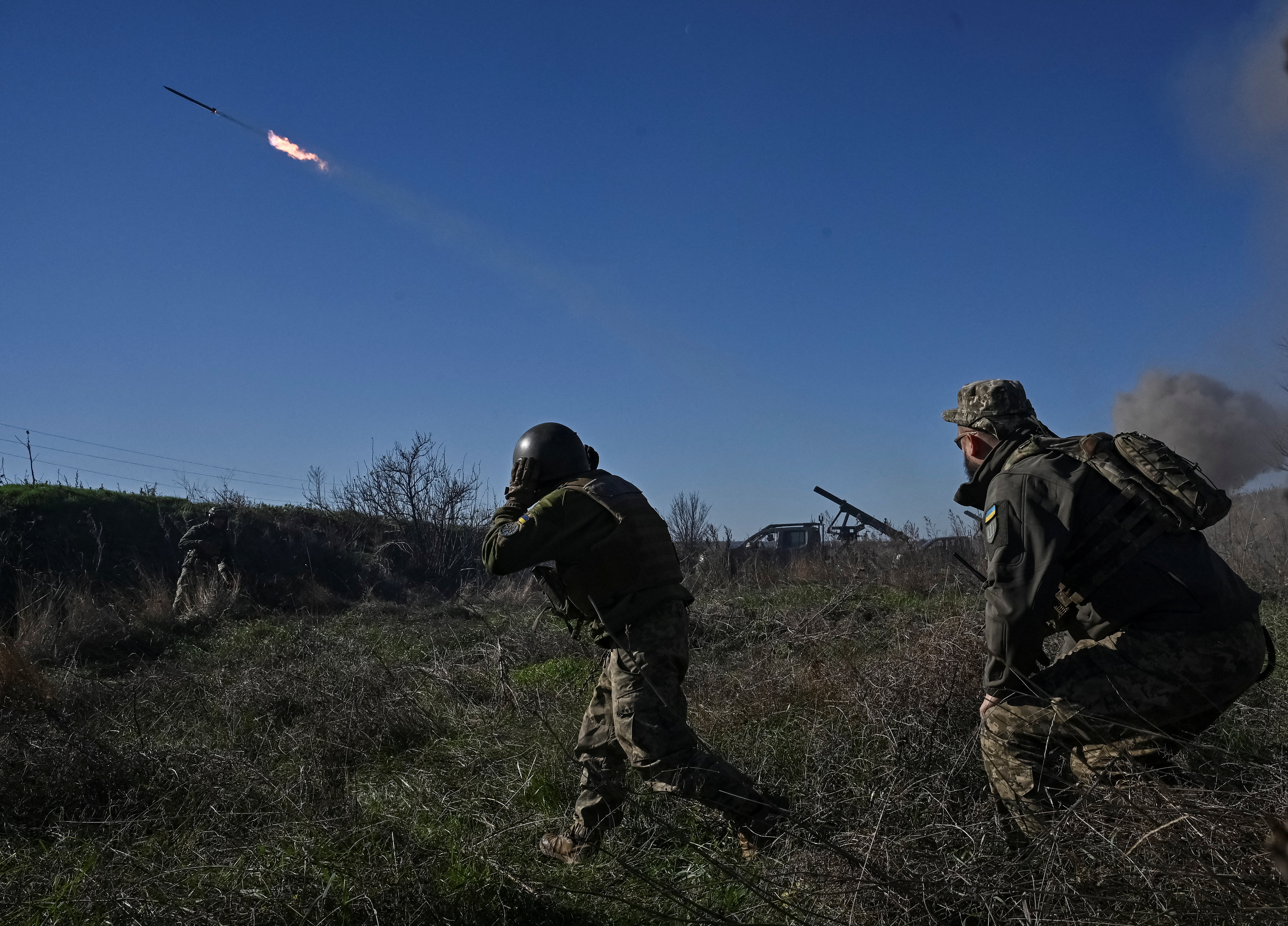 Ukrainian servicemen fire a Partyzan small MLRS for firing toward Russian troops near a front line in Zaporizhzhia region