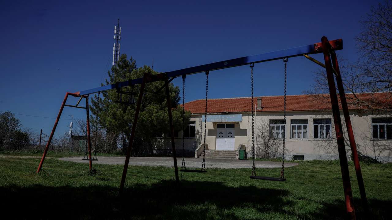 FILE PHOTO: Swings are seen outside the closed school in the village of Ormenio