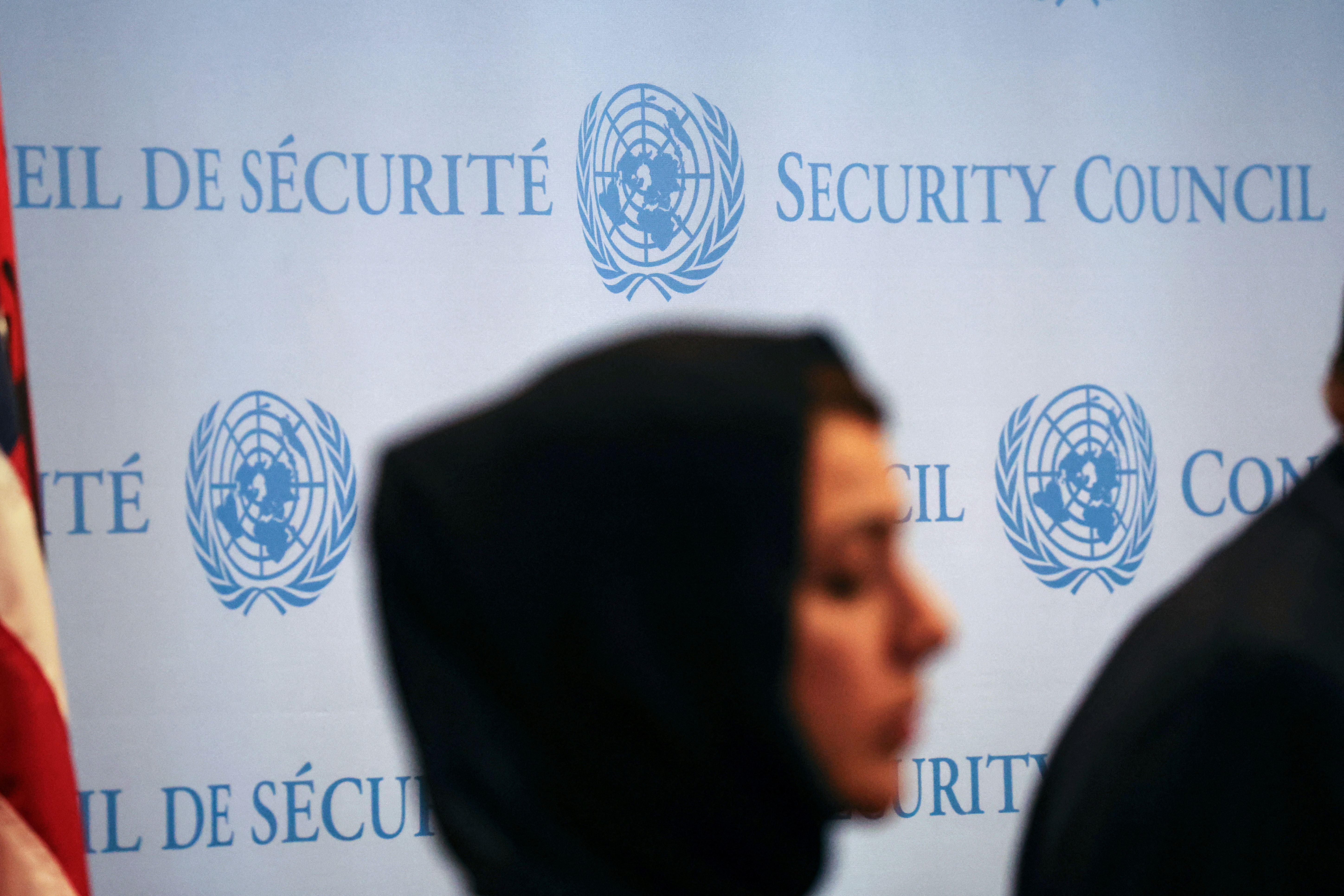 A woman stands during a press conference following the meeting on the conflict between Israel and the Palestinian Islamist group Hamas at U.N. headquarters in New York