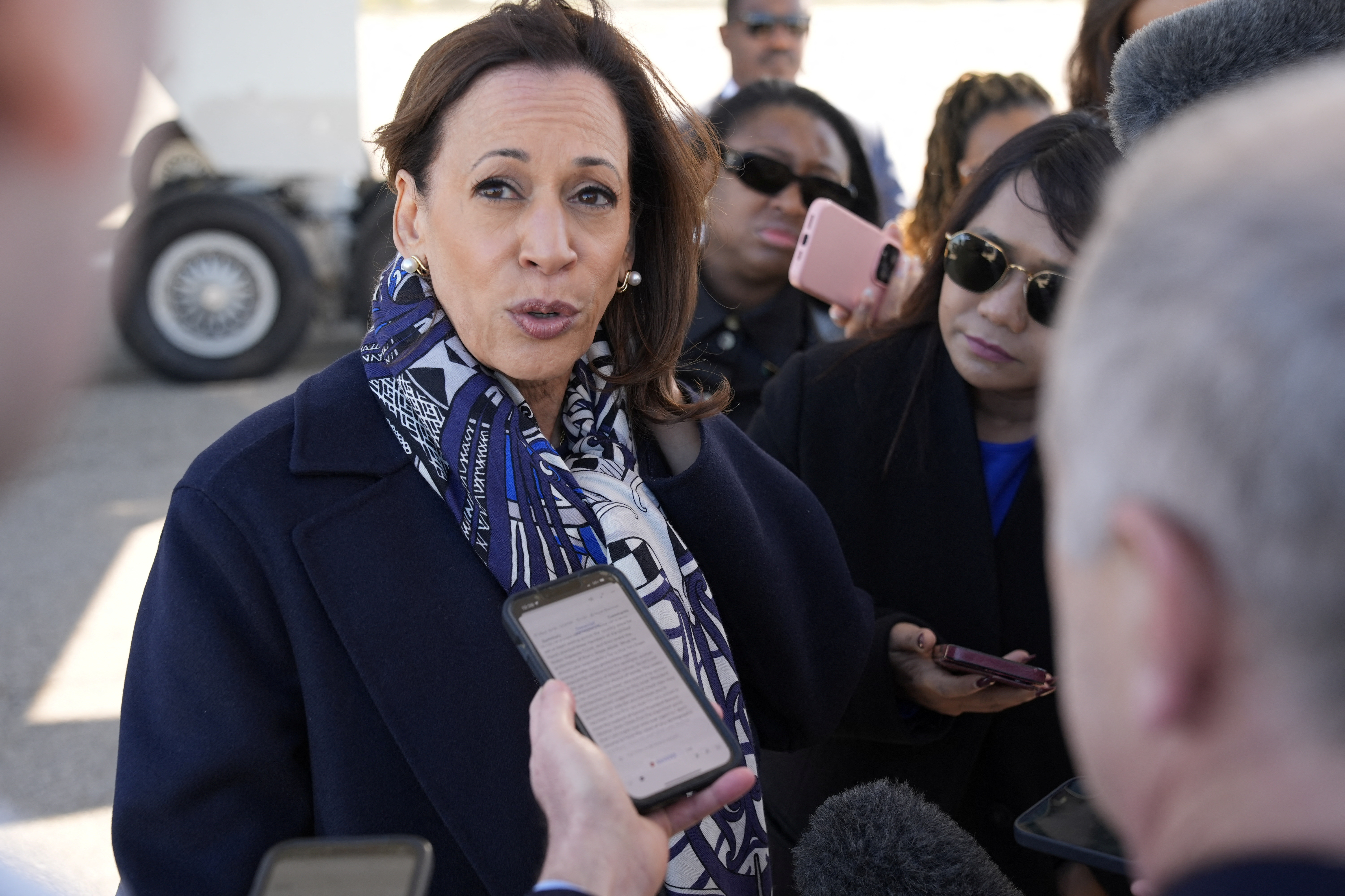 Democratic presidential nominee U.S. Vice President Kamala Harris speaks to the media before boarding Air Force Two on departure from Detroit