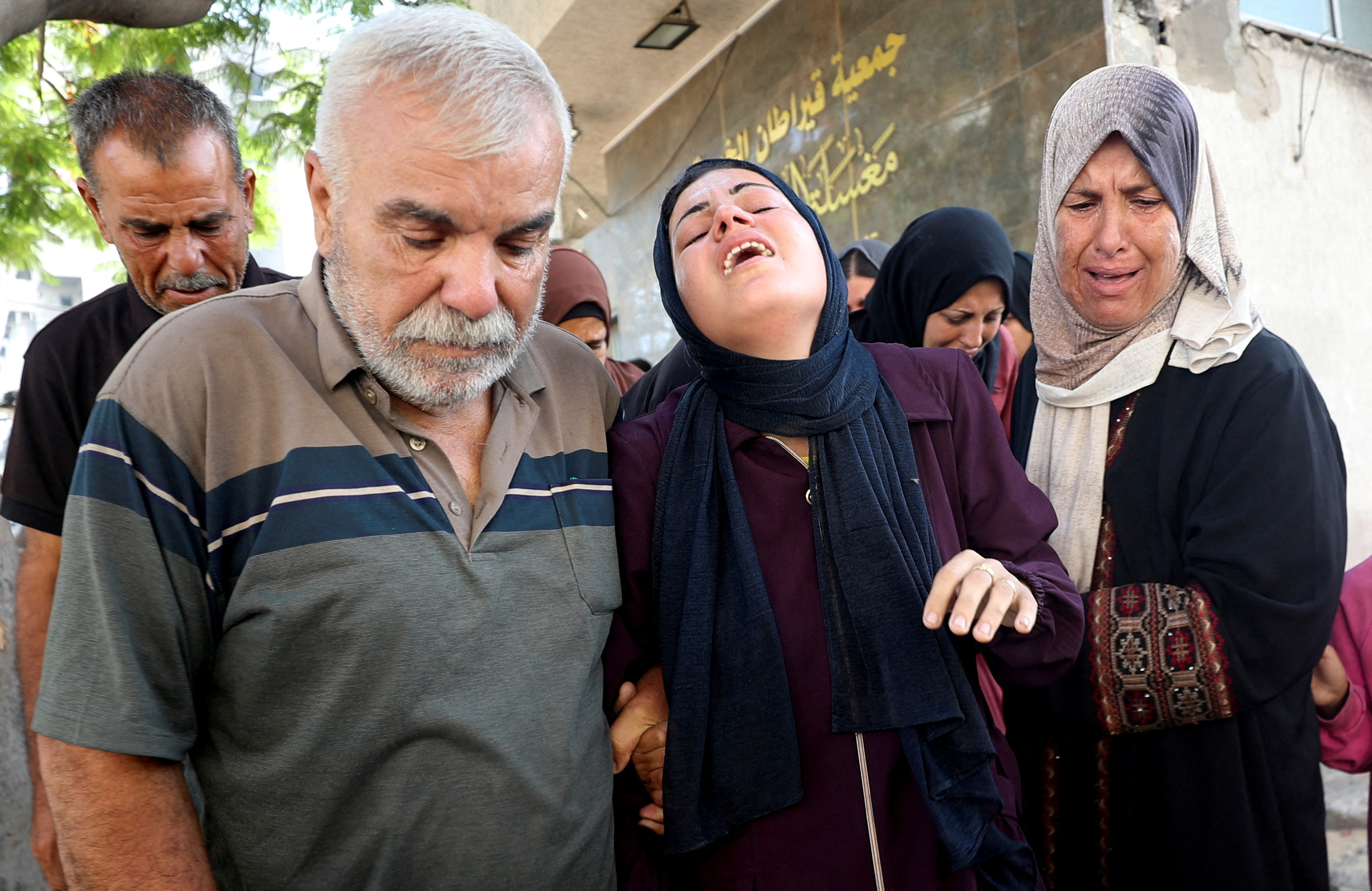 FILE PHOTO: Funeral of Palestinians who were killed by Israeli fire while trying to receive aid in central Gaza Strip, according to the Gaza Health Ministry, at Al-Shifa hospital