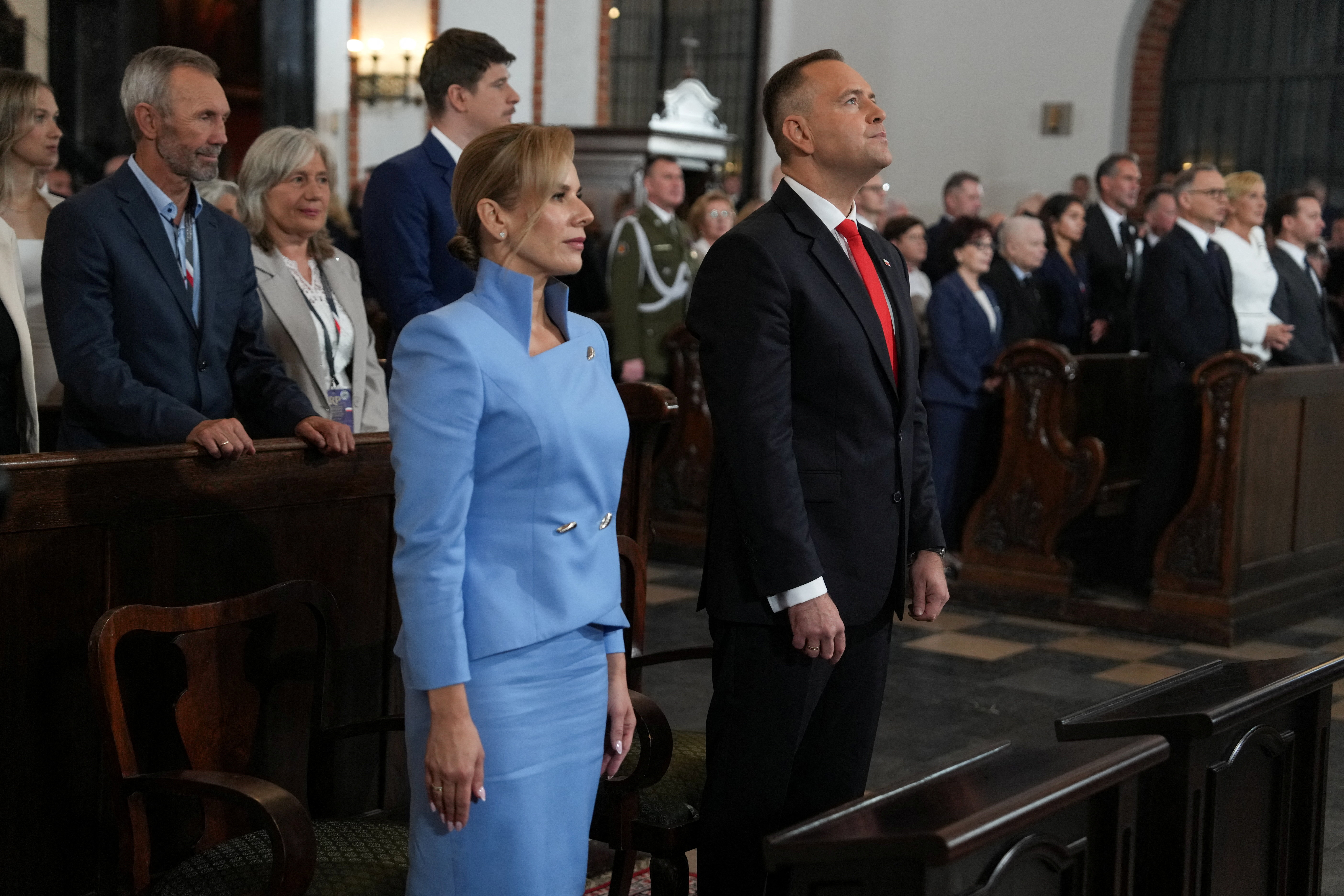 Newly sworn-in President of Poland Karol Nawrocki takes part in a service at Warsaw Cathedral in Warsaw
