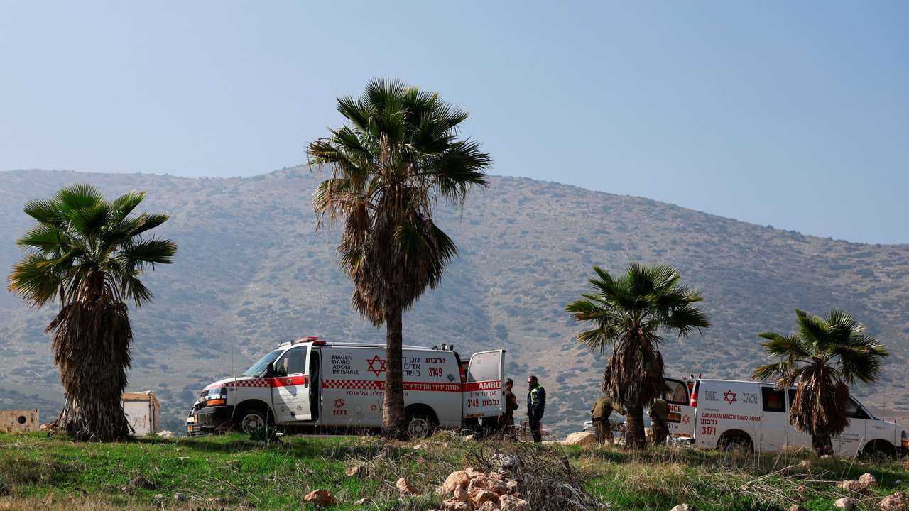 Members of the Israeli forces operate at the scene of a shooting attack in Jordan Valley, in the Israeli-occupied West Bank