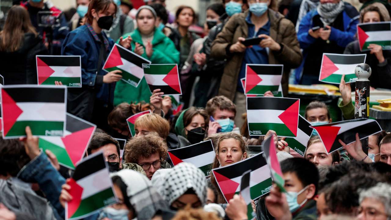 Youths take part in the occupation of a street in front of the building of the Sciences Po University in Paris
