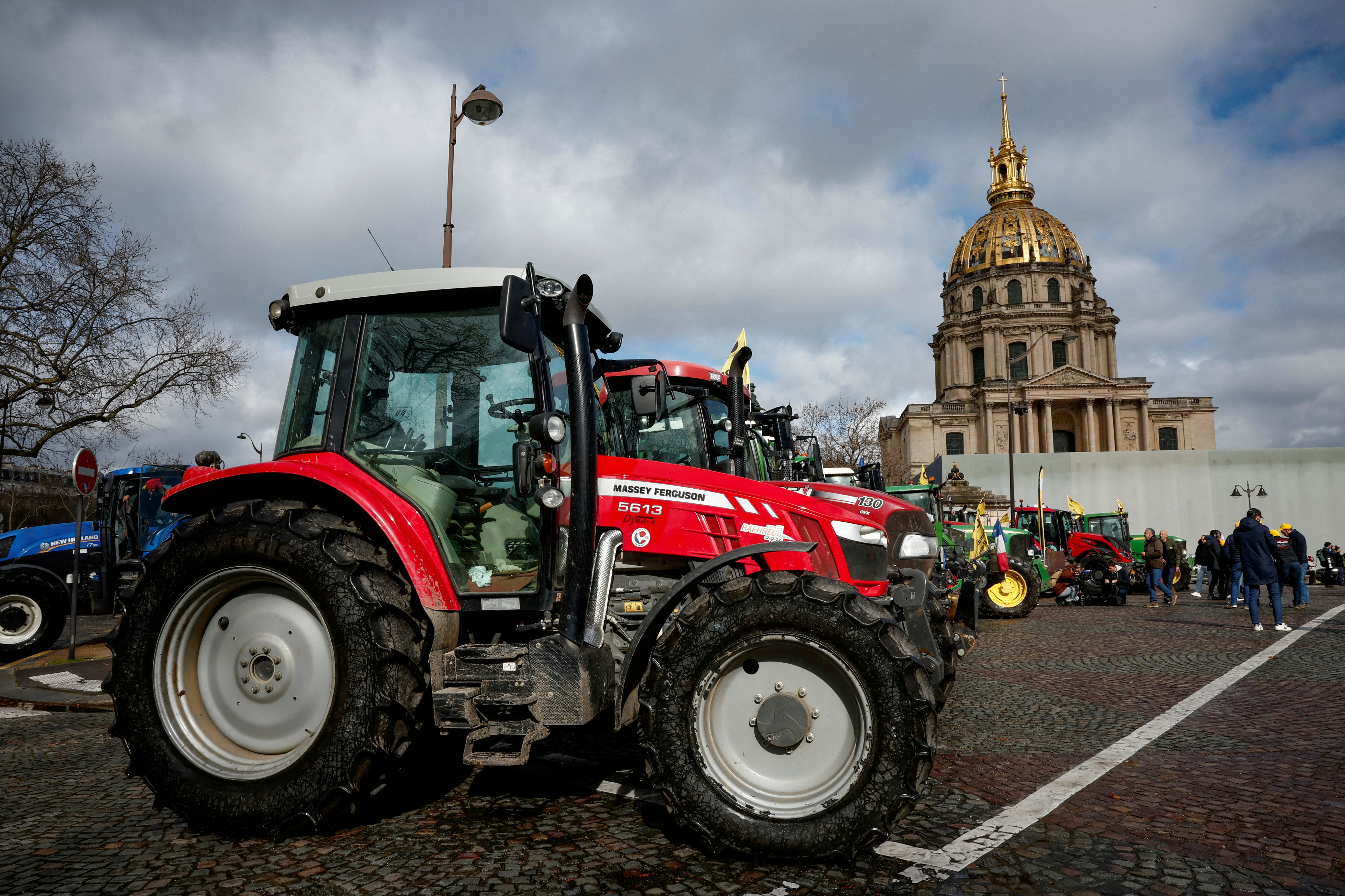FILE PHOTO: Farmers protest ahead of the opening of the Paris farm show, in Paris