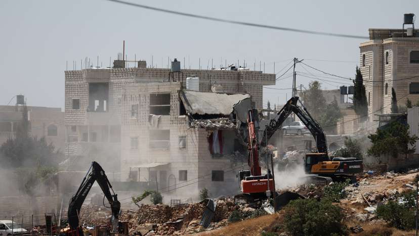 Israeli machinery demolishes a Palestinian house in Hebron