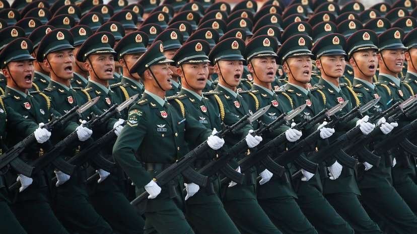 FILE PHOTO: Soldiers of People's Liberation Army (PLA) march in formation past Tiananmen Square during a rehearsal before a military parade marking the 70th founding anniversary of People's Republic of China