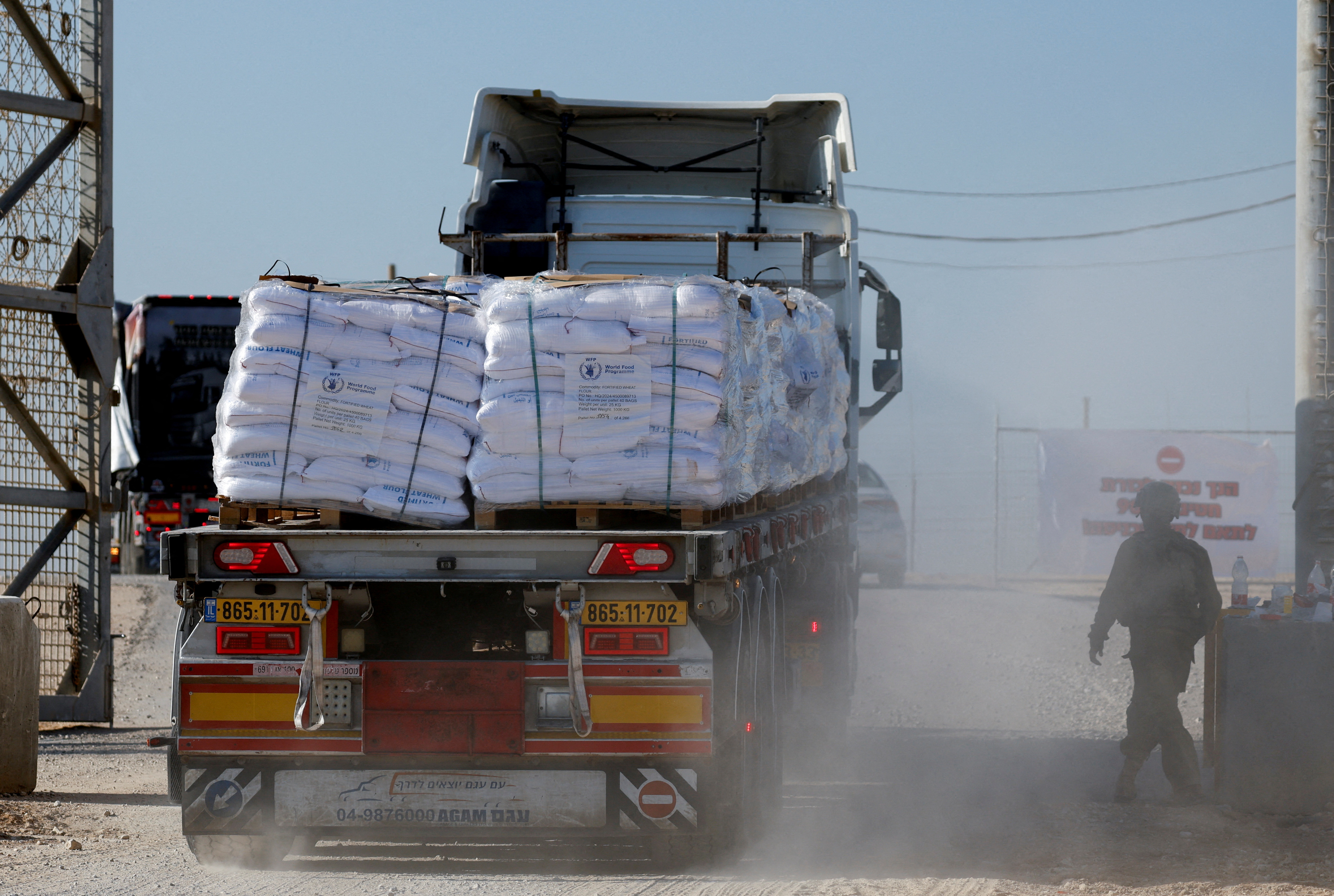 FILE PHOTO: A truck carries humanitarian aid destined for the Gaza Strip at the Kerem Shalom crossing in southern Israel