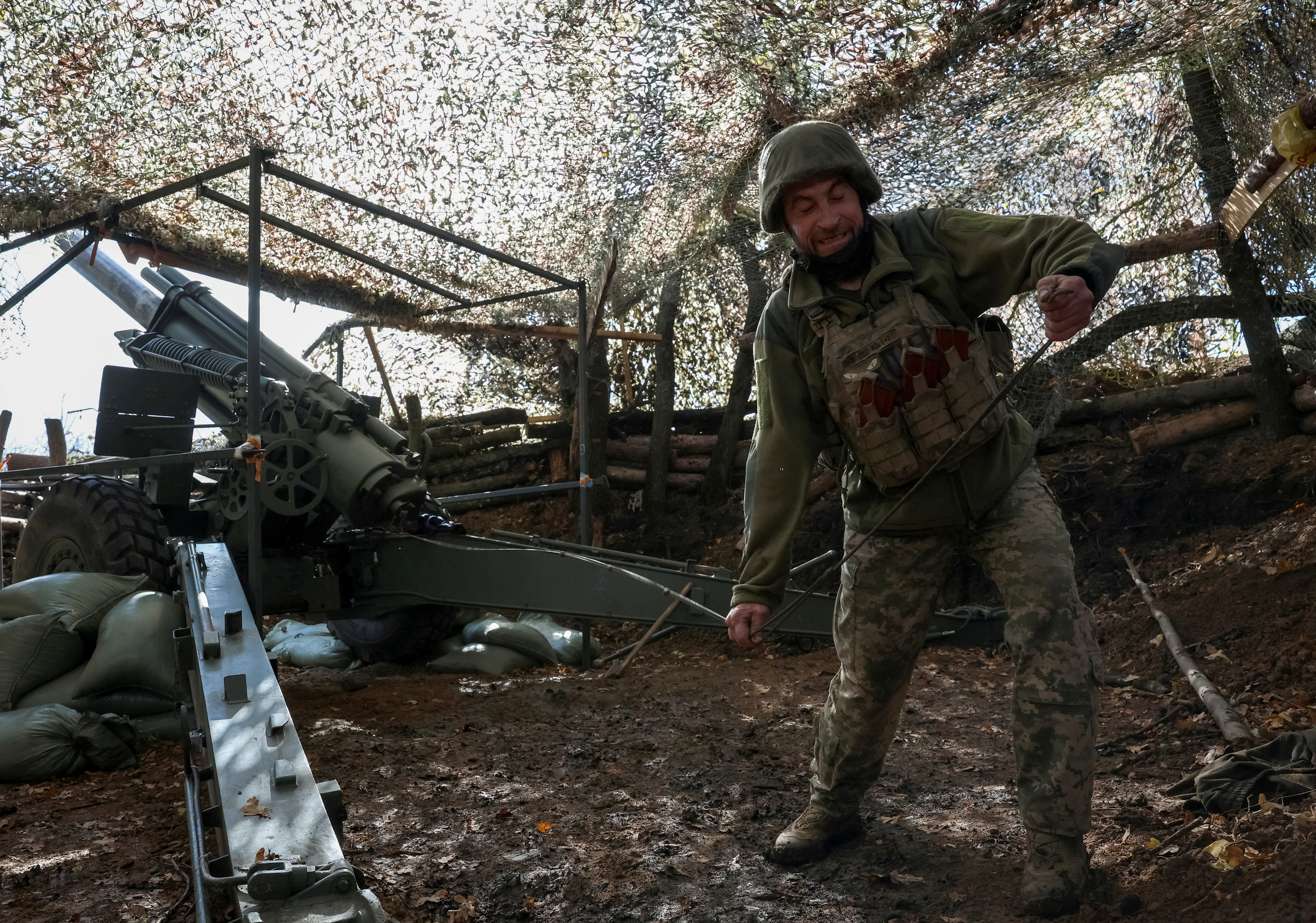Ukrainian serviceman fires a self-propelled howitzer towards Russian troops near the frontline town of Pokrovsk