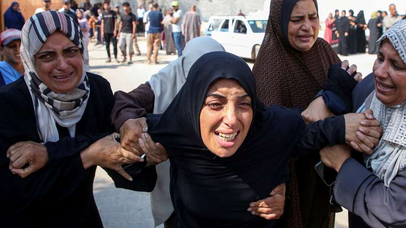Palestinians mourn detainees said to have been killed by an Israeli strike upon their release