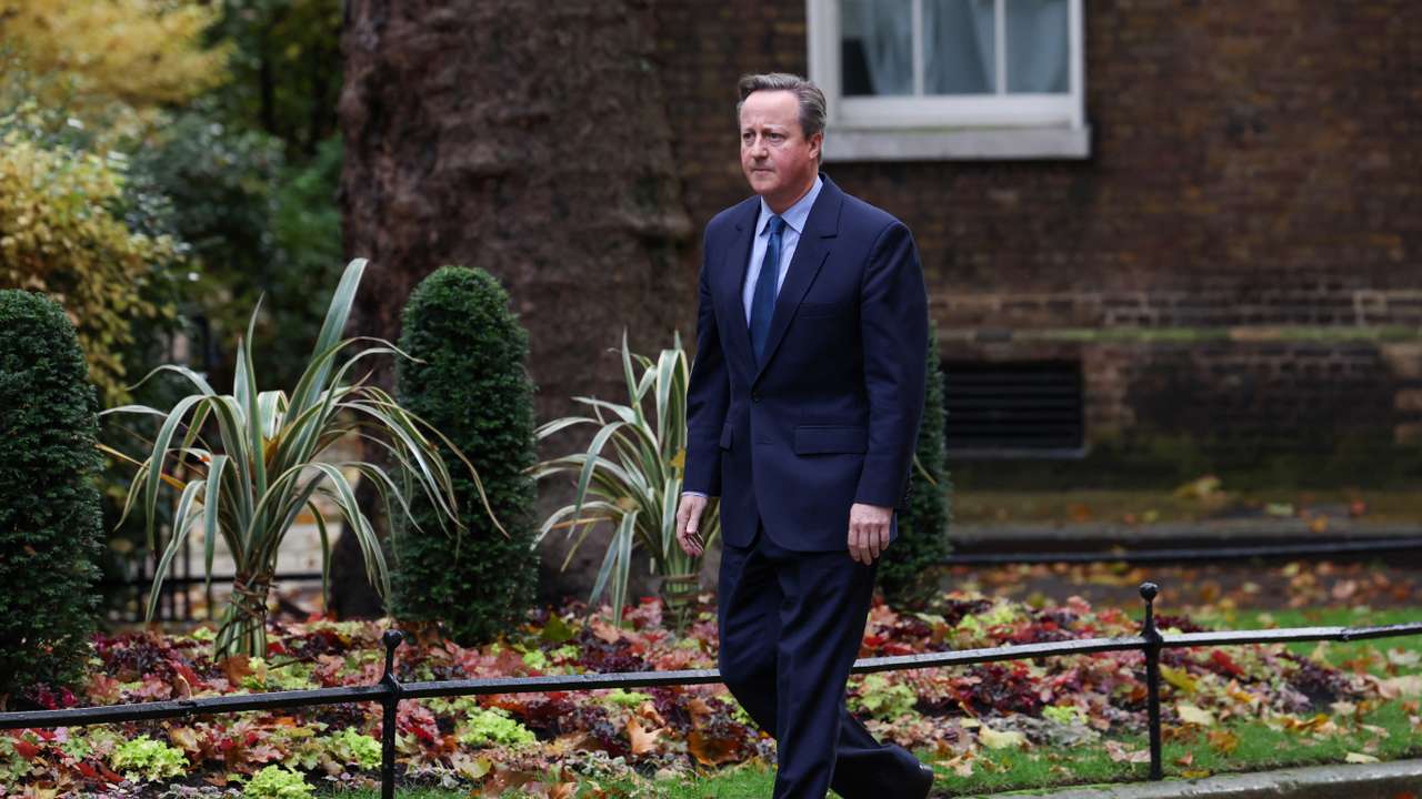 Former British Prime Minister David Cameron walks outside 10 Downing Street in London
