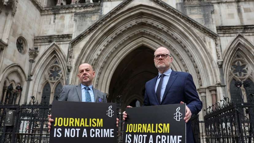 Investigative journalists Trevor Birney and Barry McCaffrey arrive at the Royal Courts of Justice, in London