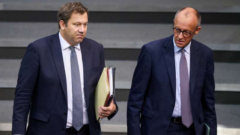FILE PHOTO: German Chancellor Merz and Finance Minister Klingbeil arrive for budget debate at the Bundestag in Berlin