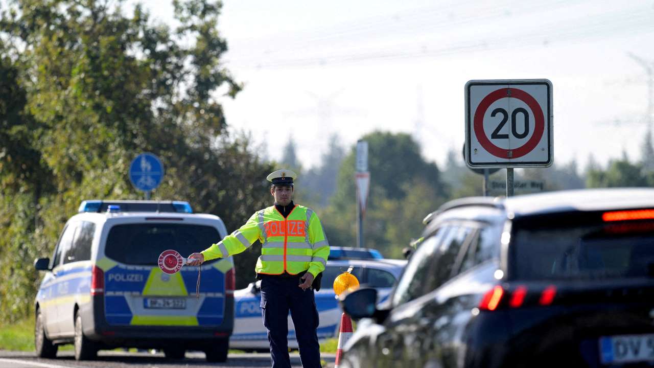 FILE PHOTO: German police conduct random checks at a border with Denmark, in Boeglum
