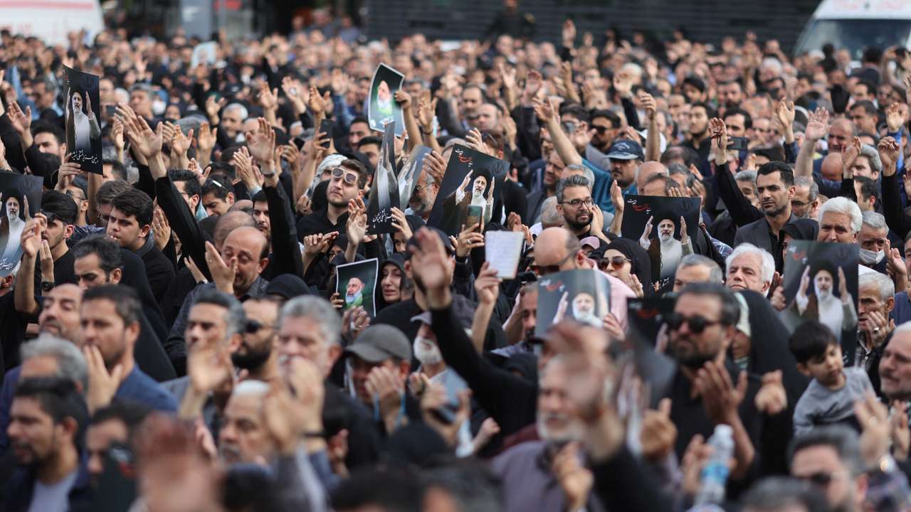 People gather to mourn for the death of the late Iran's President Ebrahim Raisi, in Tehran