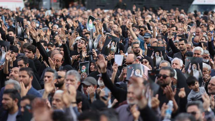 People gather to mourn for the death of the late Iran's President Ebrahim Raisi, in Tehran