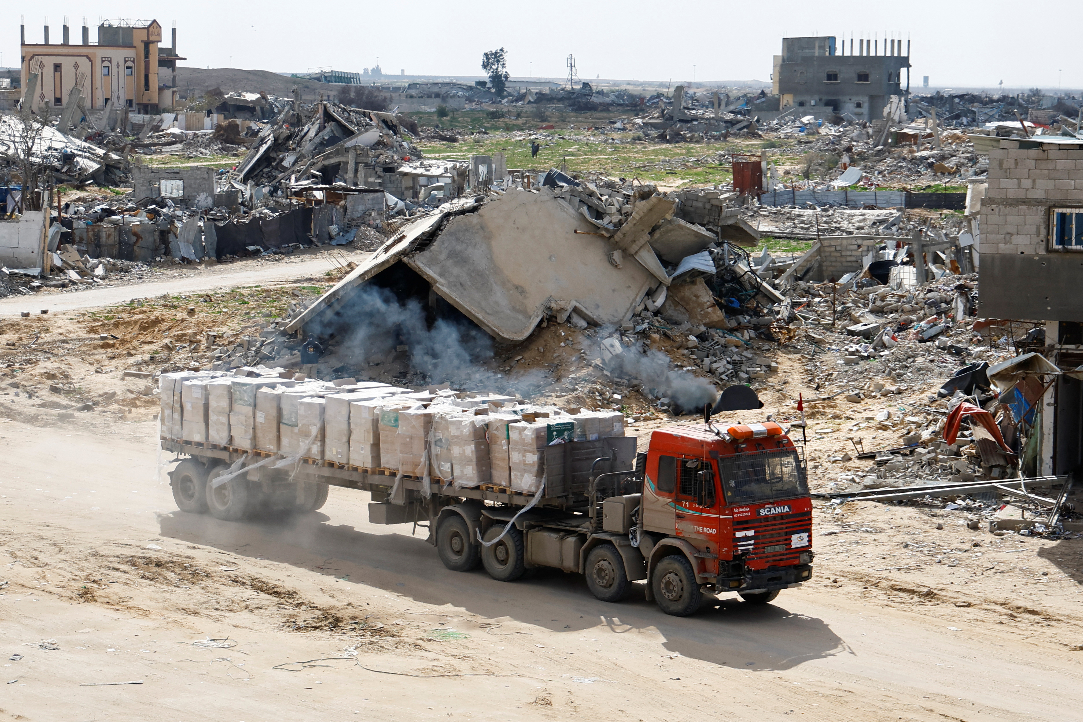 A truck carrying aid drives, amid a ceasefire between Israel and Hamas, in Rafah