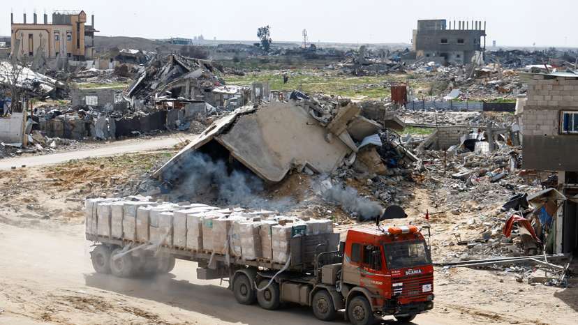 A truck carrying aid drives, amid a ceasefire between Israel and Hamas, in Rafah