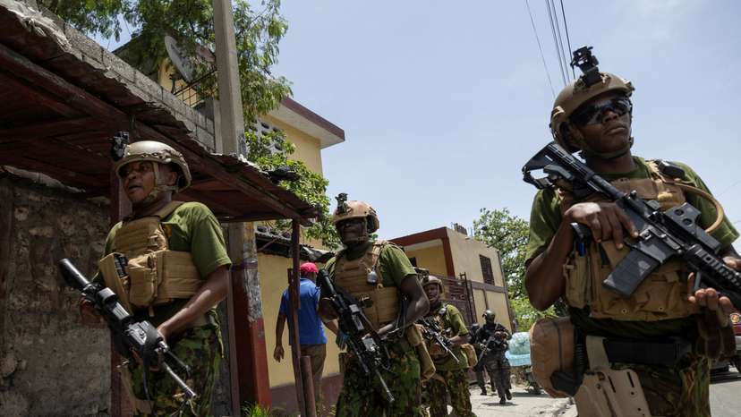 Kenyan police and Haitian National police SWAT units patrol streets in armoured vehicles, in Port-au-Prince