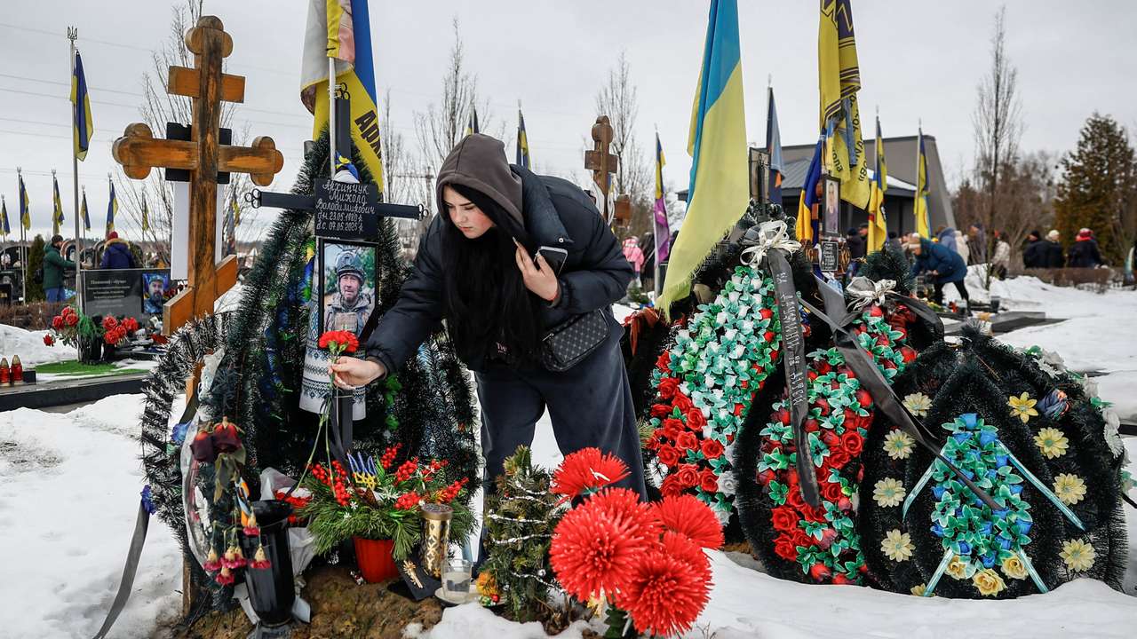 People gather to mark the fourth anniversary of the full-scale Russian invasion, in Bucha