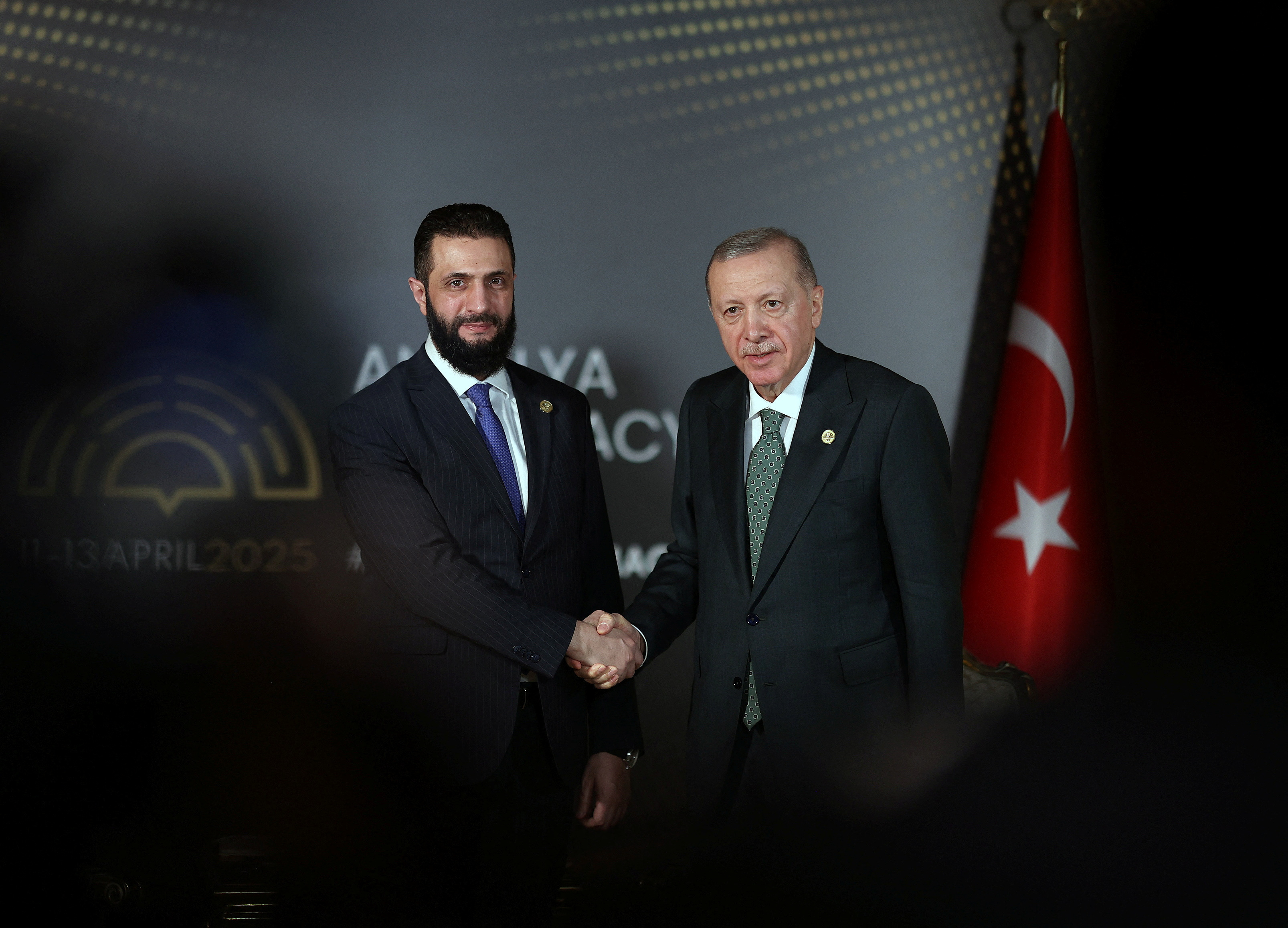 Turkey's President Tayyip Erdogan meets with Syria's interim President Ahmed al-Sharaa at Antalya Diplomacy Forum