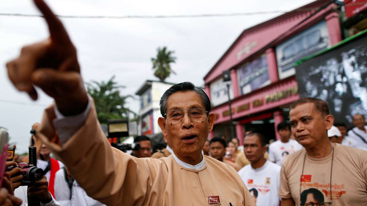 FILE PHOTO: Tin Oo, a patron of the NLD, points out other party members at a ceremony to mark the 25th anniversary of the founding of the NLD in Yangon