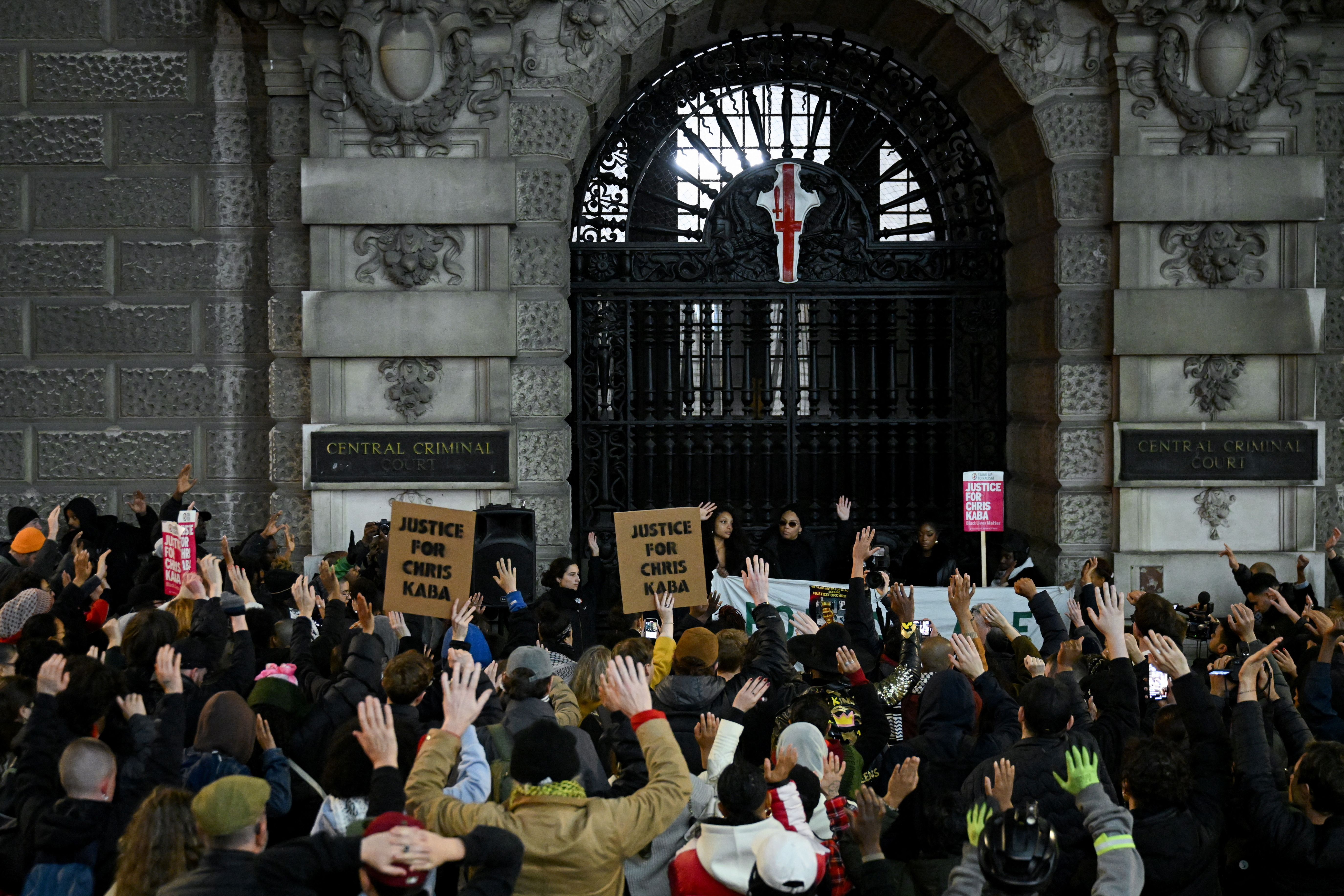 People gather outside Old Bailey after police officer was acquitted of 2022 murder of Chris Kaba, in London