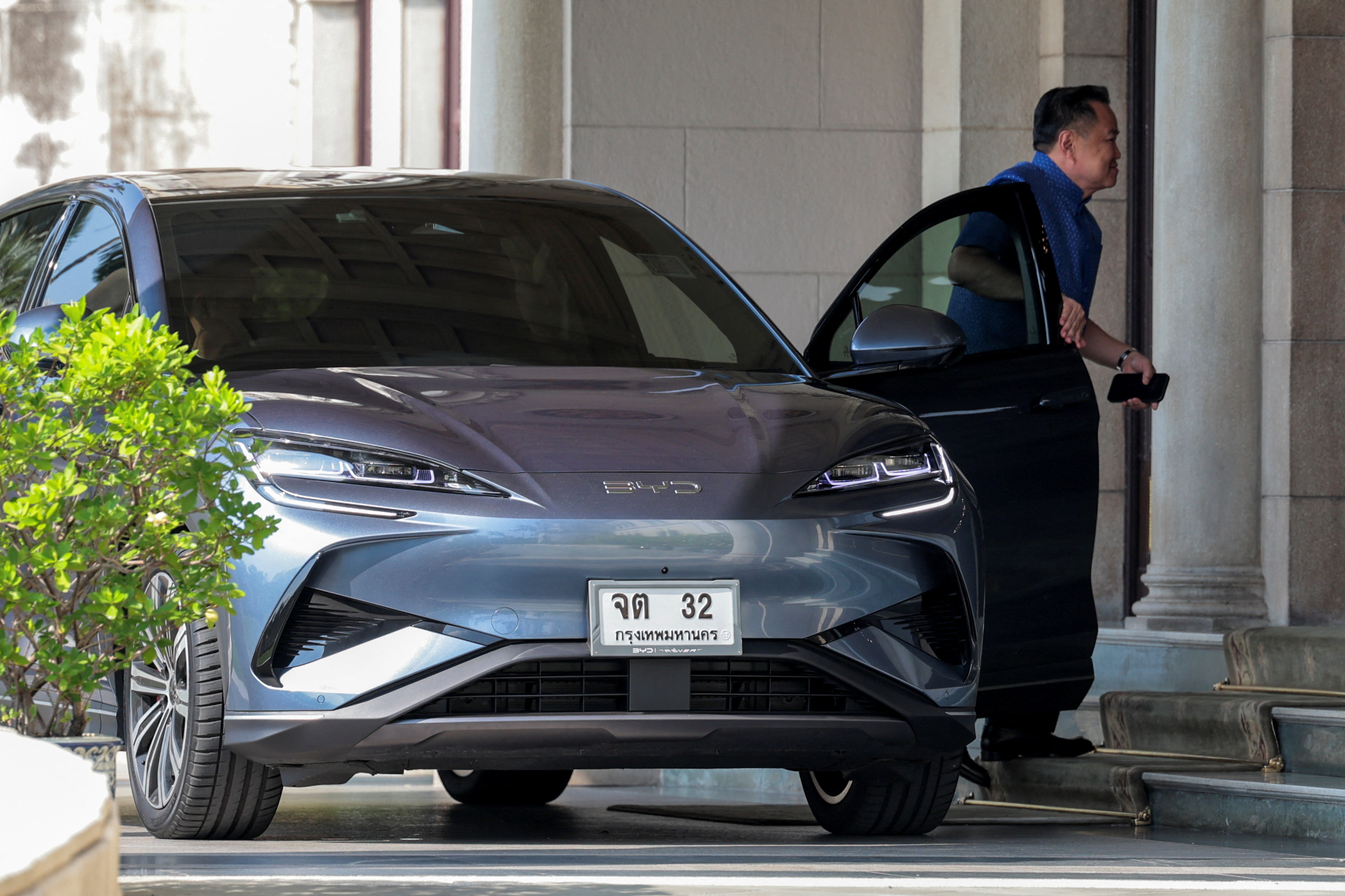 Thailand PM Anutin Charnvirakul arrives at the Government House in his BYD electric vehicle (EV)  car amid rising fuel prices due to the U.S.-Israeli conflict with Iran, in Bangkok