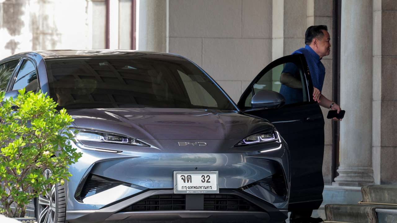 Thailand PM Anutin Charnvirakul arrives at the Government House in his BYD electric vehicle (EV) car amid rising fuel prices due to the U.S.-Israeli conflict with Iran, in Bangkok
