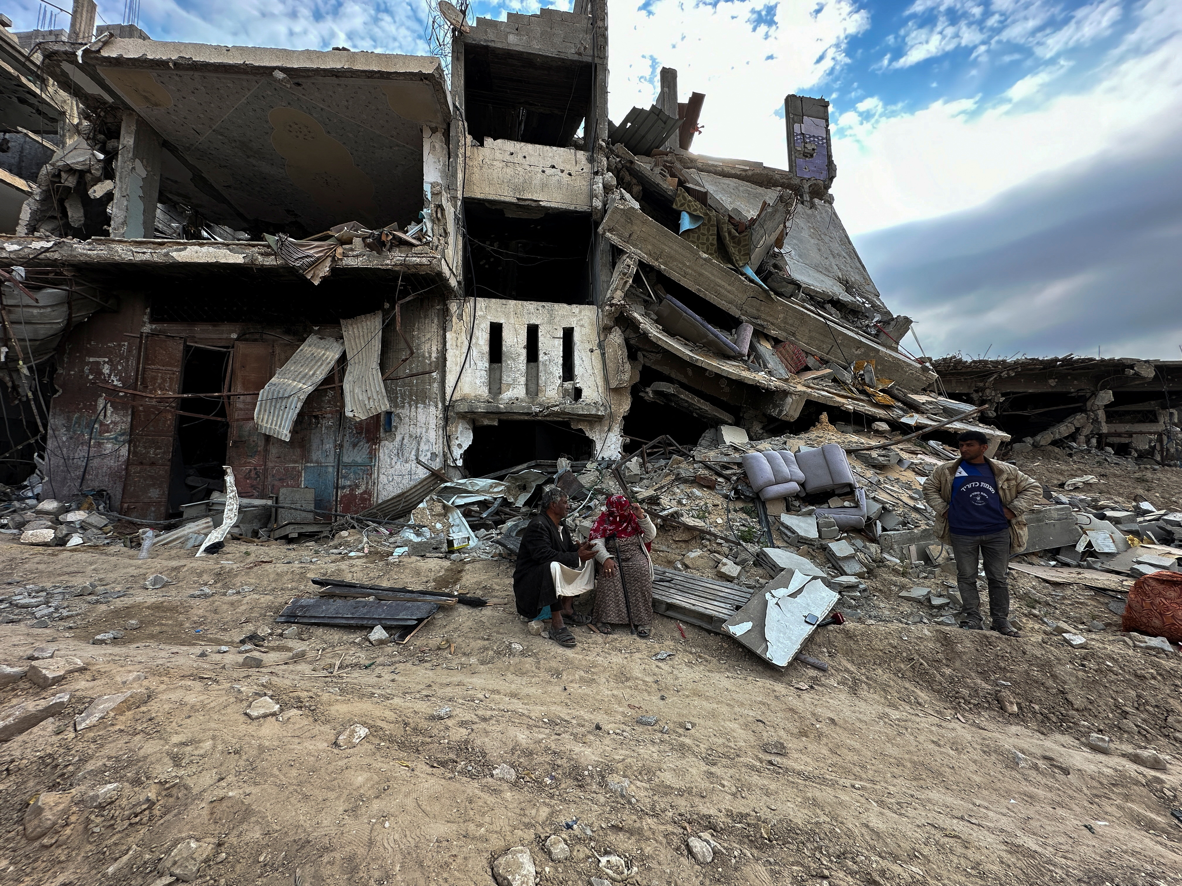 A Palestinian family returns to Khan Younis after Israeli forces withdrew from the city, southern Gaza Strip