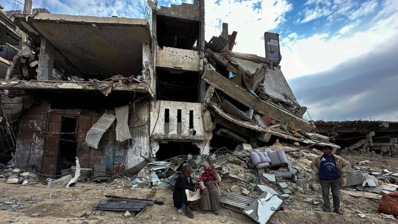A Palestinian family returns to Khan Younis after Israeli forces withdrew from the city, southern Gaza Strip