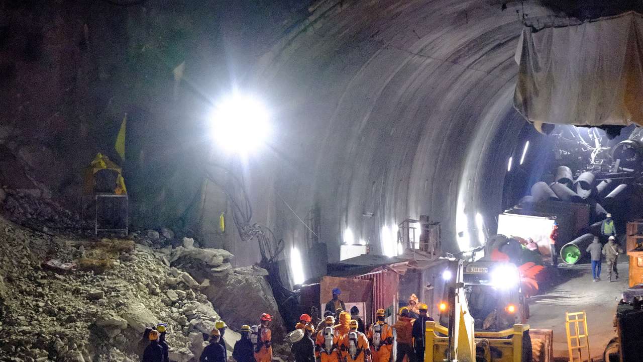 Members of the NDRF enter a tunnel with trapped workers, in Uttarkashi