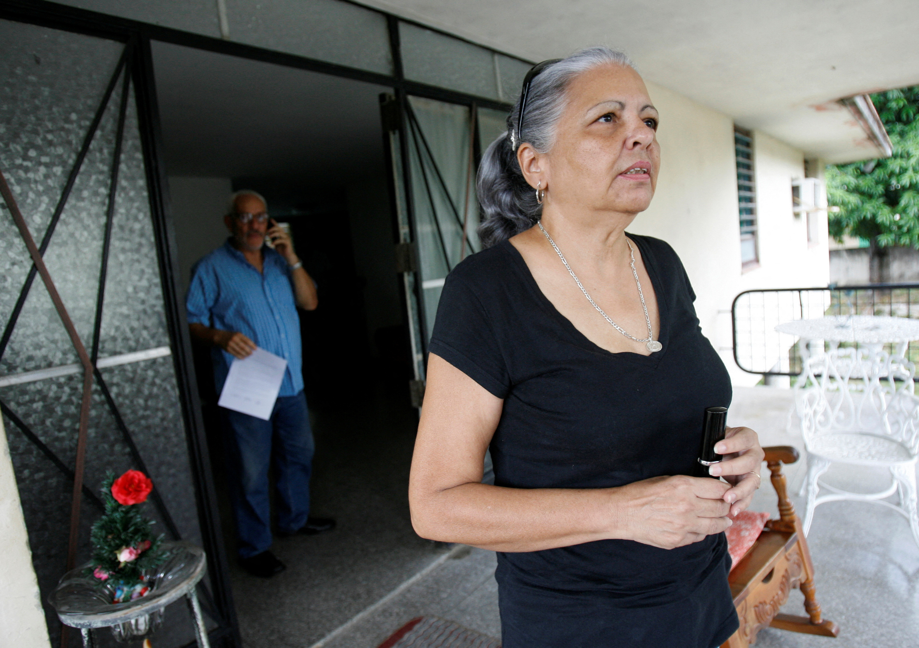 FILE PHOTO: Cuban dissident Roque stands on the porch of fellow dissident's home Vladimiro Roca in Havana
