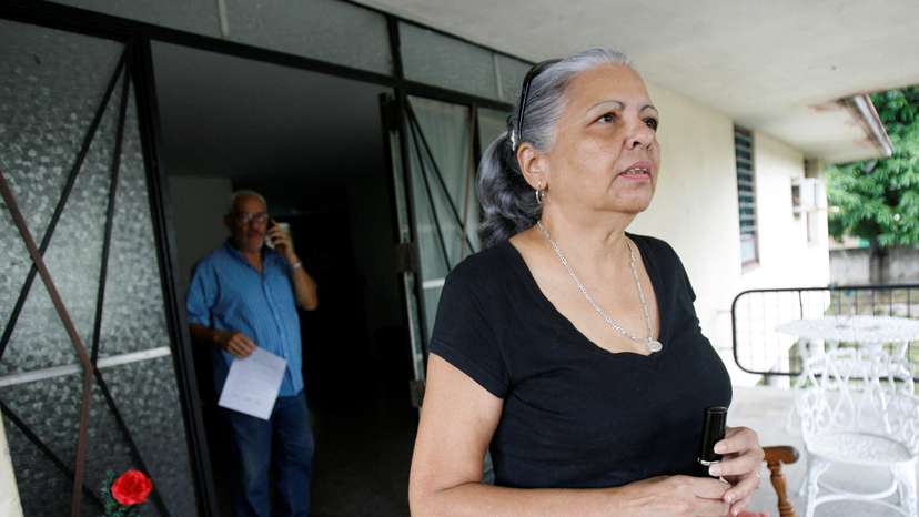 FILE PHOTO: Cuban dissident Roque stands on the porch of fellow dissident's home Vladimiro Roca in Havana