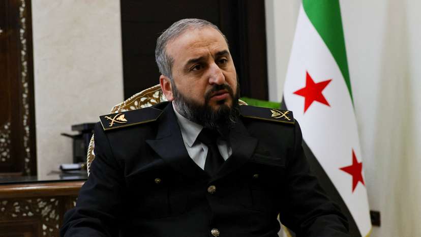 Syria's new defense minister Murhaf Abu Qasra attends an interview with Reuters in Damascus